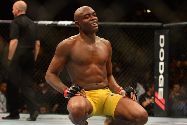 Jul. 7, 2012; Las Vegas, NV, USA; UFC fighter Anderson Silva (right) celebrates after defeating Chael Sonnen during a middleweight bout in UFC 148 at the MGM Grand Garden Arena. Mandatory Credit: Mark J. Rebilas-USA TODAY Sports