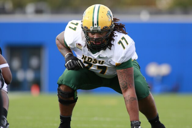 North Dakota State offensive tackle Billy Turner lines up against Indiana State during the first half of an NCAA college football game in Terre Haute, Ind., Saturday, Oct. 26, 2013.  (AP Photo/Brent Smith)