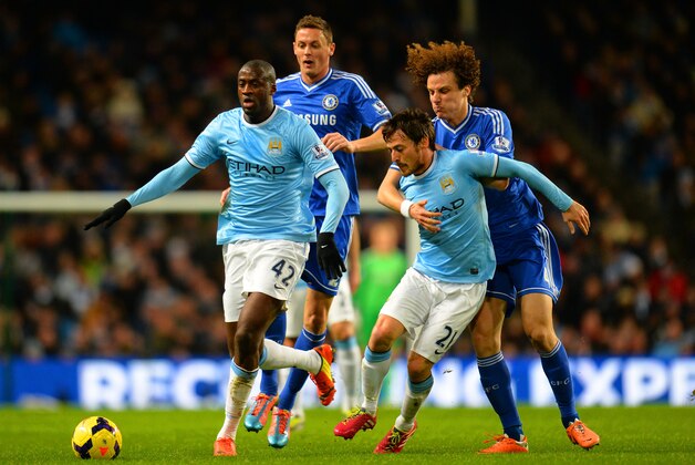 MANCHESTER, ENGLAND - FEBRUARY 03: David Luiz of Chelsea grabs hold of David Silva of Manchester City as Yaya Toure of Manchester City and Nemanja Matic of Chelsea compete for the ball during the Barclays Premier League match between Manchester City and Chelsea at Etihad Stadium on February 3, 2014 in Manchester, England. (Photo by Shaun Botterill/Getty Images) MANCHESTER, ENGLAND - FEBRUARY 03: David Luiz of Chelsea grabs hold of David Silva of Manchester City as Yaya Toure of Manchester City and Nemanja Matic of Chelsea compete for the ball during the Barclays Premier League match between Manchester City and Chelsea at Etihad Stadium on February 3, 2014 in Manchester, England. (Photo by Shaun Botterill/Getty Images)