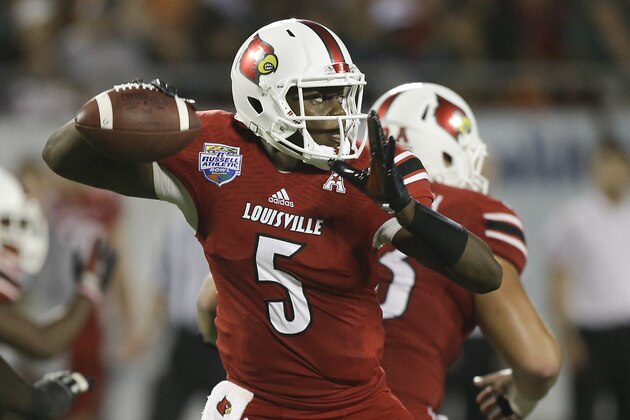 Louisville quarterback Teddy Bridgewater throws a pass during the first half of the Russell Athletic Bowl NCAA college football game against Miami in Orlando, Fla., Saturday, Dec. 28, 2013.(AP Photo/John Raoux)