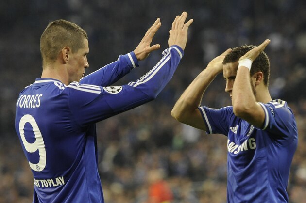 Double-scorer Chelsea's Fernando Torres congratulates his teammate Eden Hazard after scoring their side's third goal during the Champions League group E soccer match between FC Schalke 04 and Chelsea FC in Gelsenkirchen, Germany, Tuesday, Oct. 22, 2013. (AP Photo/Martin Meissner)