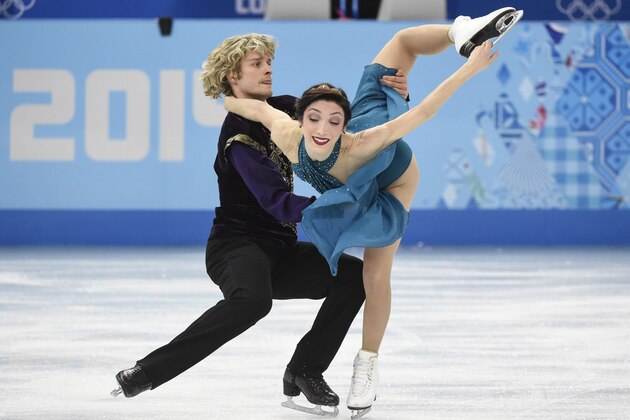 Meryl Davis and Charlie White of the United States perform their free dance in the ice dance portion of the team figure skating event at the Sochi Winter Olympics Sunday, February 9, 2014 in Sochi. (AP Photo/The Canadian Press, Paul Chiasson)