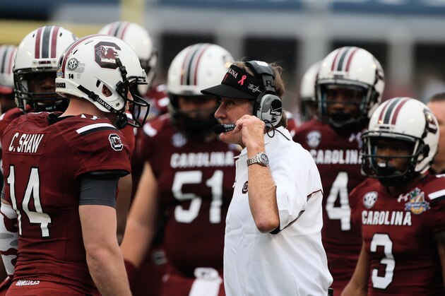 ORLANDO, FL - JANUARY 01:  Head coach Steve Spurrier of the South Carolina Gamecocks chats with his quarterback Connor Shaw #14 in the first half of their game against the Wisconsin Badgers at the Capital One Bowl on January 1, 2014 in Orlando, Florida.  (Photo by Scott Halleran/Getty Images)