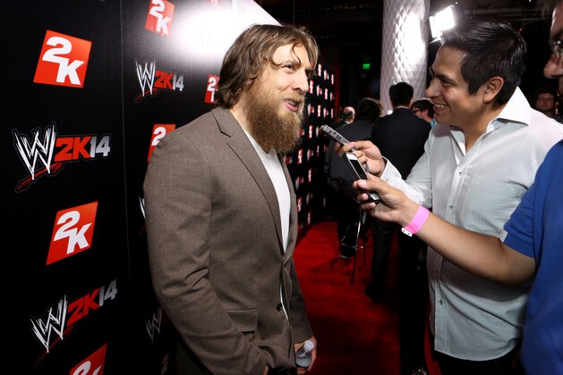 IMAGE DISTRIBUTED FOR 2K - WWE Superstar Daniel Bryan speaks to press at the WWE 2K14 press event, on Saturday, Aug. 17, 2013 in Los Angeles.  (Photo by Casey Rodgers/Invision for 2K/AP Images)