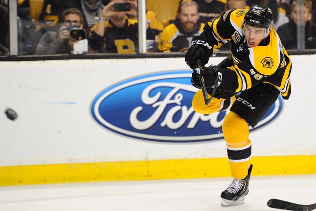 BOSTON, MA - FEBRUARY 8: Reilly Smith #18 of the Boston Bruins shoots the puck against the Ottawa Senators at the TD Garden on February 8, 2014 in Boston, Massachusetts.  (Photo by Brian Babineau/NHLI via Getty Images)