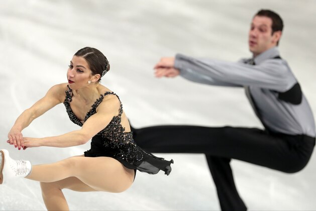 Marissa Castelli and Simon Shnapir of the United States compete in the team pairs free skate figure skating competition at the Iceberg Skating Palace during the 2014 Winter Olympics, Saturday, Feb. 8, 2014, in Sochi, Russia. (AP Photo/Ivan Sekretarev)