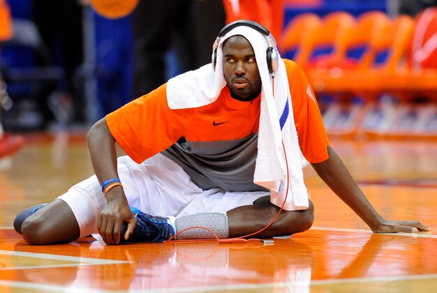 Nov 8, 2013; Syracuse, NY, USA; Syracuse Orange center Baye Moussa Keita (12) stretches prior to the game against the Cornell Big Red at Carrier Dome.  Syracuse defeated Cornell 82-60.  Mandatory Credit: Rich Barnes-USA TODAY Sports