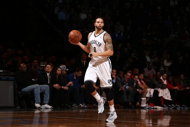 BROOKLYN, NY - JANUARY 27: Deron Williams #8 of the Brooklyn Nets brings the ball up court against the Toronto Raptors during a game at Barclays Center in Brooklyn. NOTE TO USER: User expressly acknowledges and agrees that, by downloading and or using this photograph, User is consenting to the terms and conditions of the Getty Images License Agreement. Mandatory Copyright Notice: Copyright 2014 NBAE (Photo by Nathaniel S. Butler/NBAE via Getty Images)