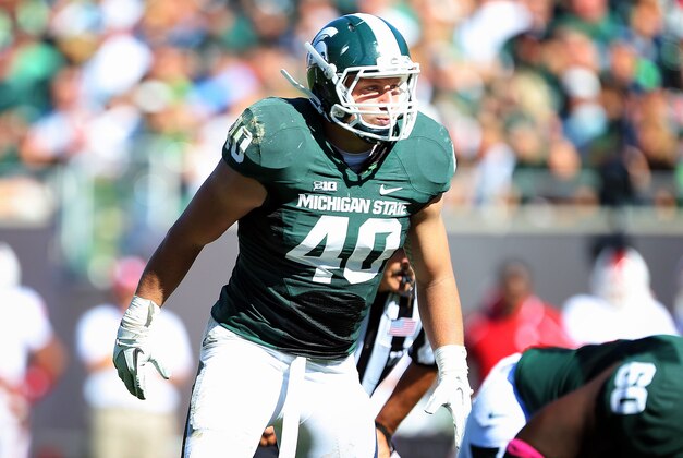 Oct 12, 2013; East Lansing, MI, USA; Michigan State Spartans linebacker Max Bullough (40) looks over Indiana Hoosiers offense during the second half in a game at Spartan Stadium. MSU won 42-28. Mandatory Credit: Mike Carter-USA TODAY Sports