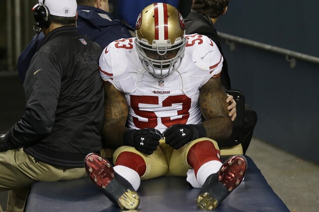 San Francisco 49ers' NaVorro Bowman is taken to the locker room on a cart after injuring his leg during the second half of the NFL football NFC Championship game against the Seattle Seahawks, Sunday, Jan. 19, 2014, in Seattle. (AP Photo/Marcio Jose Sanchez)