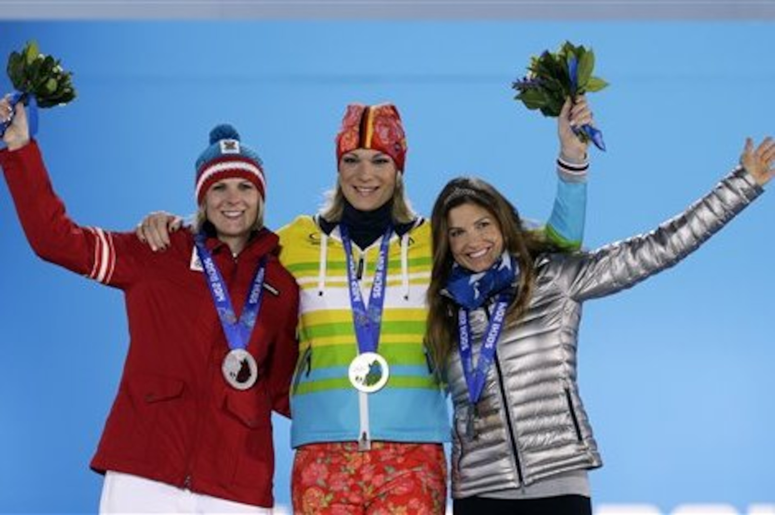 Women's super combined medalists, from left, Nicole Hosp of Austria, silver, Maria Hoefl-Riesch of Germany, gold, and Julia Mancuso of the United States, bronze, pose with their medals at the 2014 Winter Olympics in Sochi, Russia, Monday, Feb. 10, 2014. (AP Photo/Morry Gash)