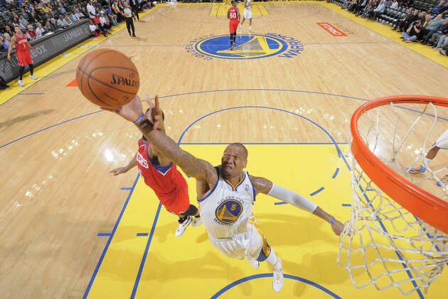 OAKLAND, CA - FEBRUARY 10: Marreese Speights #5 of the Golden State Warriors rebounds against the Philadelphia 76ers on February 10, 2014 at Oracle Arena in Oakland, California. NOTE TO USER: User expressly acknowledges and agrees that, by downloading and or using this photograph, user is consenting to the terms and conditions of Getty Images License Agreement. Mandatory Copyright Notice: Copyright 2014 NBAE (Photo by Rocky Widner/NBAE via Getty Images)