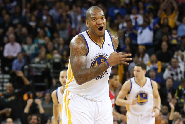 Feb 10, 2014; Oakland, CA, USA; Golden State Warriors power forward Marreese Speights (5) celebrates after scoring a three point basket against the Philadelphia 76ers during the second quarter at Oracle Arena. Mandatory Credit: Kelley L Cox-USA TODAY Sports