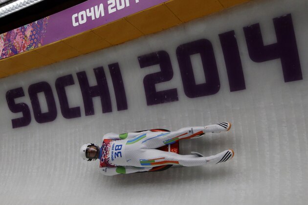 Shiva Keshavan, who if from India but is competing under the Olympics flag, takes turn five in the third run during the men's singles luge final at the 2014 Winter Olympics, Sunday, Feb. 9, 2014, in Krasnaya Polyana, Russia. (AP Photo/Dita Alangkara)