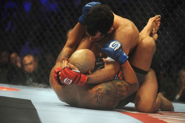 Jan 12, 2013; Oklahoma City, OK, USA; Gegard Mousasi (black shorts) and Mike Kyle (grey shorts) in their Strikeforce MMA Light Heavyweight bout at the Chesapeake Energy Arena.  Mandatory Credit: Mark D. Smith-USA TODAY Sports