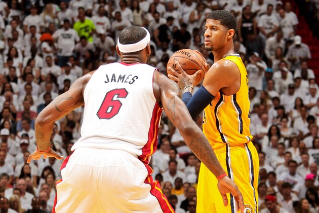 MIAMI, FL - JUNE 3: Paul George #24 of the Indiana Pacers looks to pass the ball against LeBron James #6 of the Miami Heat in Game Seven of the Eastern Conference Finals during the 2013 NBA Playoffs on June 3, 2013 at American Airlines Arena in Miami, Florida. NOTE TO USER: User expressly acknowledges and agrees that, by downloading and/or using this photograph, user is consenting to the terms and conditions of the Getty Images License Agreement. Mandatory copyright notice: Copyright NBAE 2013 (Photo by Issac Baldizon/NBAE via Getty Images)