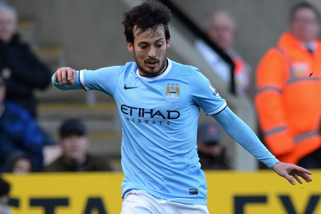 NORWICH, ENGLAND - FEBRUARY 08:  David Silva of Manchester City  during the Barclays Premier League match between Norwich City and Manchester City  at Carrow Road on February 8, 2014 in Norwich, England.  (Photo by Tony Marshall/Getty Images)