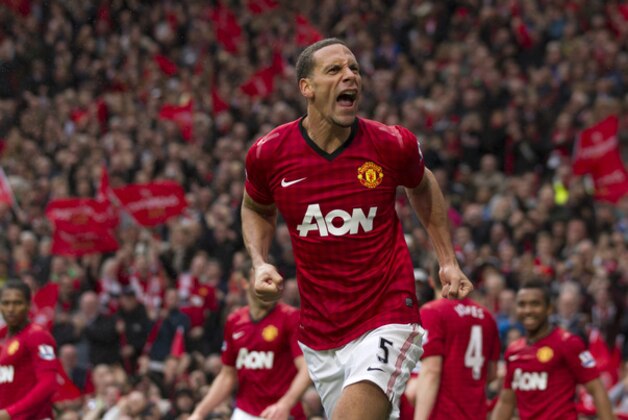 Manchester United's Rio Ferdinand celebrates after scoring against Swansea City during their English Premier League soccer match at Old Trafford Stadium, Manchester, England, Sunday May 12, 2013. (AP Photo/Jon Super)