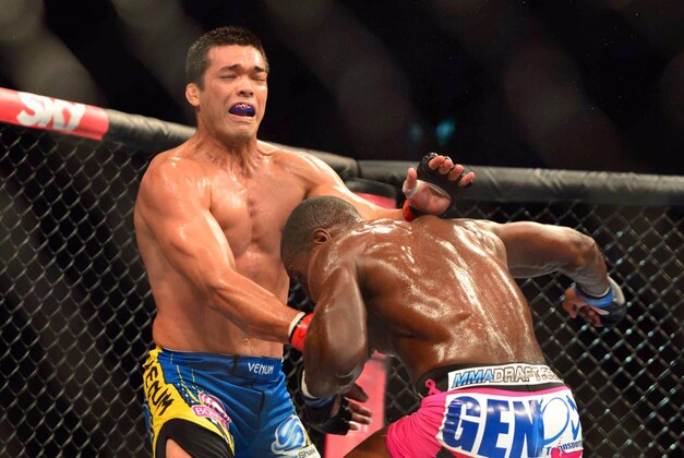 Aug 3, 2013; Rio De Janeiro, Brazil; Phil Davis (pink shorts) fights against Lyoto Machida (blue shorts) during UFC 163 at HSBC Arena. Mandatory Credit: Jason Silva-USA TODAY Sports