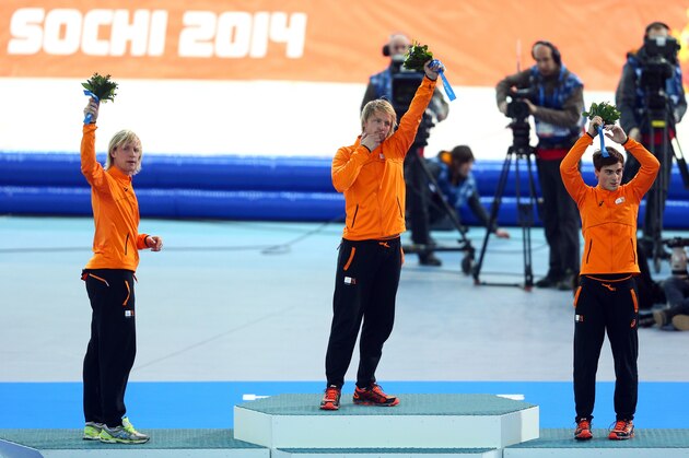 SOCHI, RUSSIA - FEBRUARY 10:  (L-R) Bronze medalist Ronald Mulder of the Netherlands, gold medallist Michel Mulder of the Netherlands and Silver medalist Jan Smeekens of the Netherlands celebrate on the podium during the flower ceremony for the Men's 500m Speed Skating event during day 3 of the Sochi 2014 Winter Olympics at Adler Arena Skating Center on February 10, 2014 in Sochi, Russia.  (Photo by Paul Gilham/Getty Images)