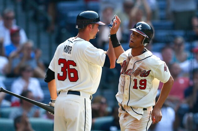 ATLANTA, GA - JUNE 30:  Andrelton Simmons #19 of the Atlanta Braves celebrates with Mike Minor #36 after scoring in the fourth inning against the Washington Nationals at Turner Field on June 30, 2012 in Atlanta, Georgia.  (Photo by Kevin C. Cox/Getty Images)