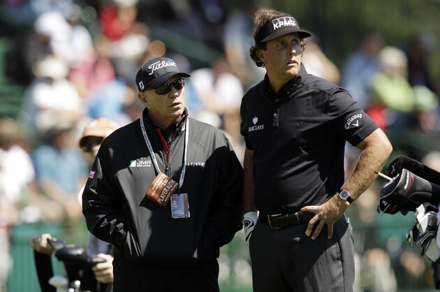 Phil Mickelson talks to coach Butch Harmon during a practice round for the U.S. Open Championship golf tournament Tuesday, June 12, 2012, at The Olympic Club in San Francisco. (AP Photo/Charlie Riedel)