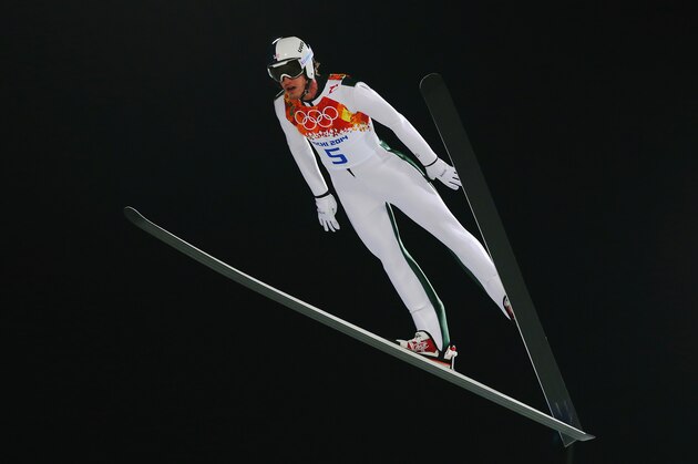SOCHI, RUSSIA - FEBRUARY 09: Anders Johnson of the United States jumps during the Men's Normal Hill Individual on day 2 of the Sochi 2014 Winter Olympics at the RusSki Gorki Ski Jumping Center on February 9, 2014 in Sochi, Russia.  (Photo by Julian Finney/Getty Images)