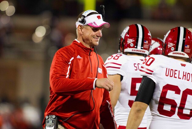 Oct 19, 2013; Champaign, IL, USA;  Wisconsin Badgers head coach Gary Andersen congratulates his team after a touchdown against the Illinois Fighting Illini at Memorial Stadium. Wisconsin wins 56-32 over Illinois. Mandatory Credit: Trevor Ruszkowksi-USA TODAY Sports