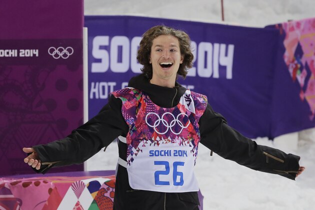 Switzerland's Iouri Podladtchikov celebrates after he won the gold medal in the men's snowboard halfpipe final at the Rosa Khutor Extreme Park, at the 2014 Winter Olympics, Tuesday, Feb. 11, 2014, in Krasnaya Polyana, Russia. (AP Photo/Andy Wong)