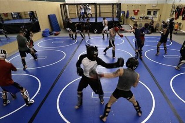 Fighters train at Fight Club Proving Ground gym in Waterford, March 6, 2013. Michigan lawmakers are pushing for legislation to regulate amateur mixed martial arts to protect fighters from injury and disease. When the sport was legalized in 2007, the professional bouts became regulated, but the amateurs were overlooked. Lawmakers and fighters say it's created a system in Michigan where anything goes. (AP Photo/Paul Sancya)