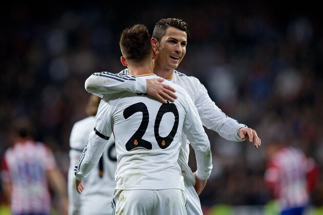 MADRID, SPAIN - FEBRUARY 05:  Jese Rodriguez (L) of Real Madrid CF celebrates scoring their second goal with team mate Cristiano Ronaldo (R) during the Copa del Rey semifinal first leg match between Real Madrid CF and Club Atletico Madrid at Estadio Santiago Bernabeu on February 5, 2014 in Madrid, Spain.  (Photo by Gonzalo Arroyo Moreno/Getty Images)