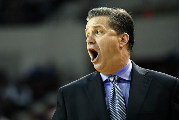 Kentucky basketball coach John Calipari shouts to his players in the second half of an NCAA college basketball game against Mississippi State in Starkville, Miss., Saturday, Feb. 8, 2014. No. 18 Kentucky won 69-59. (AP Photo/Rogelio V. Solis)
