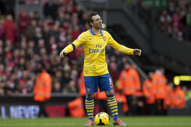 Arsenal's Santi Cazorla raises his arms as his team is beaten 5-1 by Liverpool during their English Premier League soccer match at Anfield Stadium, Liverpool, England, Saturday Feb. 8, 2014. (AP Photo/Jon Super)