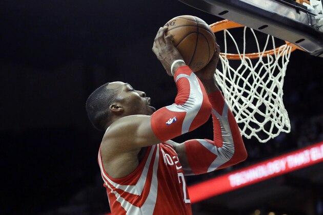 Houston Rockets' Dwight Howard shoots against the Minnesota Timberwolves in the second half of an NBA basketball game Monday, Feb. 10, 2014, in Minneapolis. The Rockets won 107-89. (AP Photo/Jim Mone)