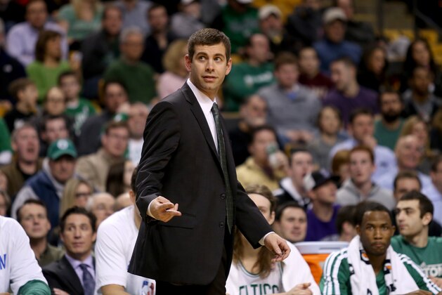 Boston Celtics head coach Brad Stevens gestures from the bench during the first half of an NBA basketball game against the Sacramento Kings, Friday, Feb. 7, 2014 in Boston. (AP Photo/Mary Schwalm)