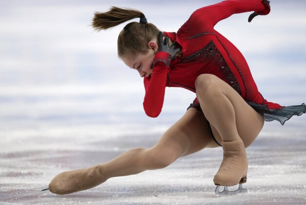 Julia Lipnitskaia of Russia competes in the women's team free skate figure skating competition at the Iceberg Skating Palace during the 2014 Winter Olympics, Sunday, Feb. 9, 2014, in Sochi, Russia. (AP Photo/Bernat Armangue)