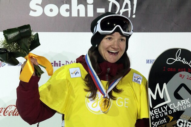 FILE - In this Feb. 14, 2013 file photo, Kelly Clark celebrates on the podium after the women's Halfpipe of the FIS Snowboard World Cup 2013, in Rosa Khutor ski resort near Sochi, Russia. Clark is among Vermont’s lineup of at least 11 athletes who will compete in the 2014 Winter Olympics in Sochi. (AP Photo/Mikhail Metzel, File)
