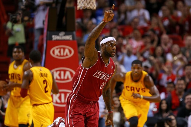 MIAMI, FL - DECEMBER 14:  LeBron James #6 of the Miami Heat reacts to a play during a game against the Cleveland Cavaliers at American Airlines Arena on December 14, 2013 in Miami, Florida. NOTE TO USER: User expressly acknowledges and agrees that, by downloading and/or using this photograph, user is consenting to the terms and conditions of the Getty Images License Agreement. Mandatory copyright notice:  (Photo by Mike Ehrmann/Getty Images)