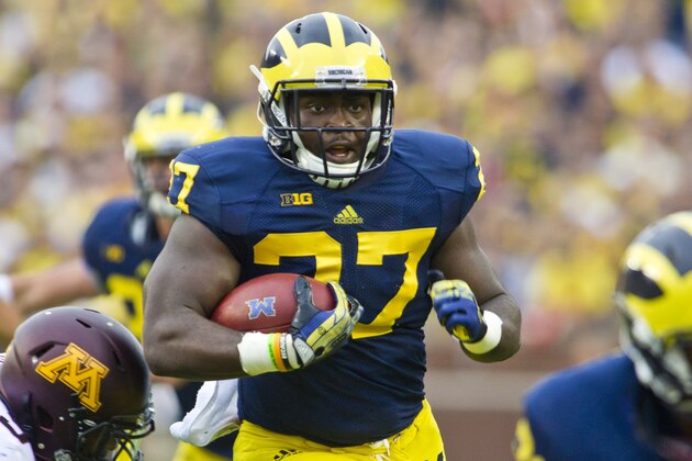 Michigan running back Derrick Green (27) rushes in the first quarter of an NCAA college football game against Minnesota, Saturday, Oct. 5, 2013, in Ann Arbor, Mich. (AP Photo/Tony Ding)