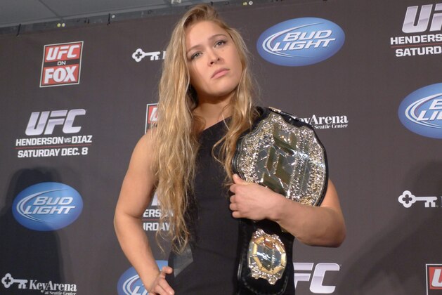 (Rowdy) Ronda Rousey shows off her UFC bantamweight championship belt, on Thursday Dec. 6, 2012. UFC president Dana White handed out the belt Thursday, saying the former Strikeforce title-holder will make her UFC debut on Feb., 23 against Liz Carmouche. (AP Photo/The Canadian Press, Neil Davidson) (Rowdy) Ronda Rousey shows off her UFC bantamweight championship belt, on Thursday Dec. 6, 2012. UFC president Dana White handed out the belt Thursday, saying the former Strikeforce title-holder will make her UFC debut on Feb., 23 against Liz Carmouche. (AP Photo/The Canadian Press, Neil Davidson)