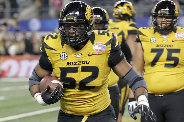 Missouri defensive lineman Michael Sam (52) warms up before the Cotton Bowl NCAA college football game against Oklahoma State, Friday, Jan. 3, 2014, in Arlington, Texas.  (AP Photo/Tim Sharp)