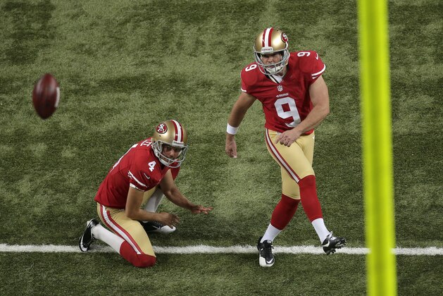San Francisco 49ers kicker Phil Dawson (9) kicks an extra point after punter Andy Lee (4) held the ball during the third quarter of an NFL football game against the St. Louis Rams Thursday, Sept. 26, 2013, in St. Louis. (AP Photo/Charlie Riedel) San Francisco 49ers kicker Phil Dawson (9) kicks an extra point after punter Andy Lee (4) held the ball during the third quarter of an NFL football game against the St. Louis Rams Thursday, Sept. 26, 2013, in St. Louis. (AP Photo/Charlie Riedel)