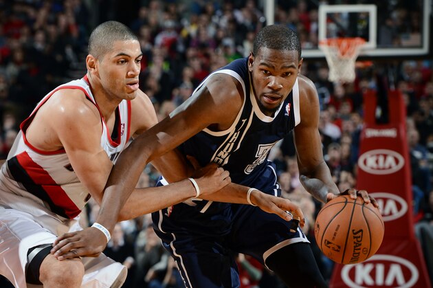 PORTLAND, OR - FEBRUARY 11: Kevin Durant #35 of The Oklahoma City Thunder drives to the basket against the Portland Trail Blazers on February 11, 2014 at the Moda Center in Portland, Oregon. NOTE TO USER: User expressly acknowledges and agrees that, by downloading and/or using this Photograph, user is consenting to the terms and conditions of the Getty Images License Agreement. Mandatory Copyright Notice: Copyright 2014 NBAE (Photo by Garrett W. Ellwood/NBAE via Getty Images)