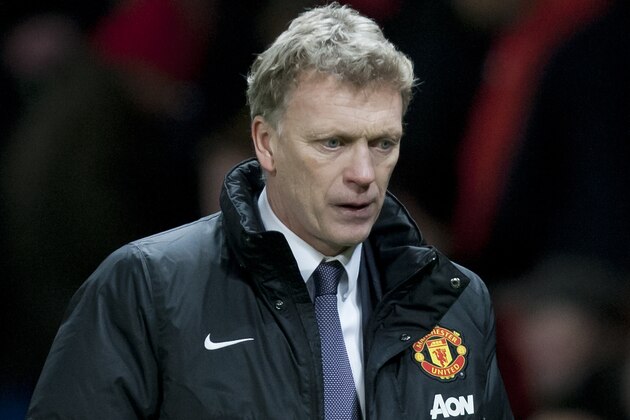 Manchester United's manager David Moyes walks from the pitch after his team's 2-2 draw against Fulham in their English Premier League soccer match at Old Trafford Stadium, Manchester, England, Sunday Feb. 9, 2014. (AP Photo/Jon Super)