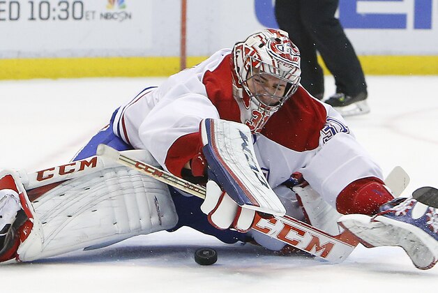 Montreal Canadiens goalie Carey Price stops a Detroit Red Wings shot in the second period of an NHL hockey game, Friday, Jan. 24, 2014, in Detroit. (AP Photo/Paul Sancya)