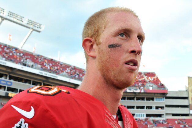 TAMPA, FL -  DECEMBER 8:  Quarterback Mike Glennon #8 of the Tampa Bay Buccaneers leaves the field after play against the Buffalo Bills December 8, 2013 at Raymond James Stadium in Tampa, Florida.  The Buxs won 27 - 6.  (Photo by Al Messerschmidt/Getty Images)