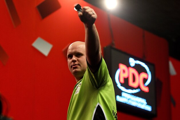LONDON, ENGLAND - DECEMBER 30:  Michael van Gerwen of The Netherlands celebrates victory after defeating Adrian Lewis of England in their semi final match on day fifteen of the Ladbrokes.com World Darts Championship at Alexandra Palace on December 30, 2013 in London, England.  (Photo by Ben Hoskins/Getty Images)