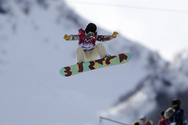 United States' Kelly Clark competes in the women's snowboard half pipe qualifying at the Rosa Khutor Extreme Park, at the 2014 Winter Olympics, Wednesday, Feb. 12, 2014, in Krasnaya Polyana, Russia. (AP Photo/Sergei Grits)