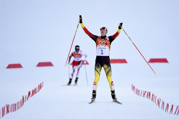 SOCHI, RUSSIA - FEBRUARY 12:  Eric Frenzel of Germany celebrates as he wins the gold medal during the Nordic Combined Individual Gundersen Normal Hill and 10km Cross Country on day 5 of the Sochi 2014 Winter Olympics at the RusSki Gorki Nordic Combined Skiing Stadium on February 12, 2014 in Sochi, Russia.  (Photo by Lars Baron/Getty Images)