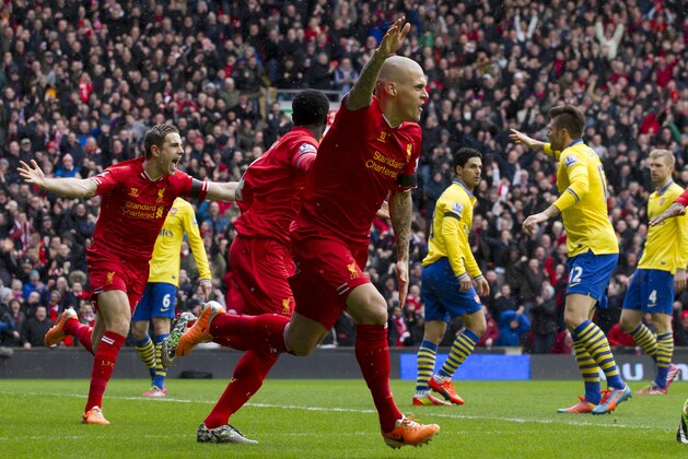 Liverpool's Martin Skrtel, centre, celebrates after scoring against Arsenal during their English Premier League soccer match at Anfield Stadium, Liverpool, England, Saturday Feb. 8, 2014. (AP Photo/Jon Super) Liverpool's Martin Skrtel, centre, celebrates after scoring against Arsenal during their English Premier League soccer match at Anfield Stadium, Liverpool, England, Saturday Feb. 8, 2014. (AP Photo/Jon Super)
